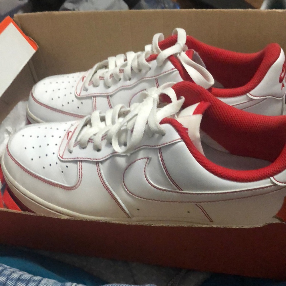 Red stitch on white Air Force ones.
